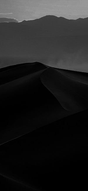 Monochromatic Black Sand Dunes with Distant Mountain Silhouettes in Minimalist Landscape HD phone wallpaper