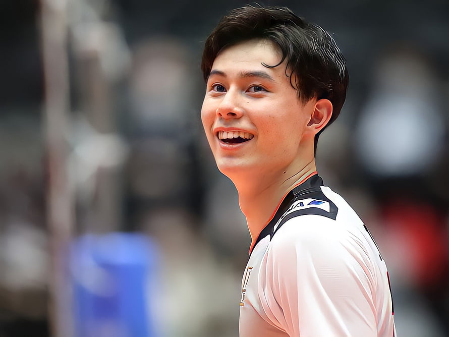 Ran Takahashi smiling in white basketball jersey with black collar and orange trim on the court HD wallpaper