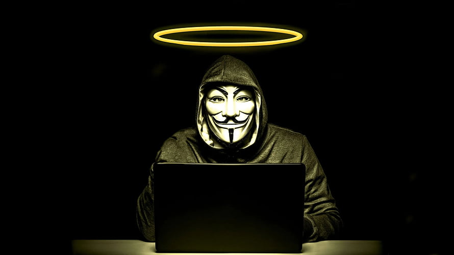Anonymous Guy Fawkes Mask Hacker at Laptop with Glowing Halo HD wallpaper