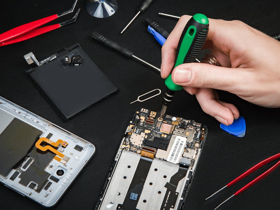 Smartphone Internal Repair with Precision Tools and Circuit Board HD wallpaper