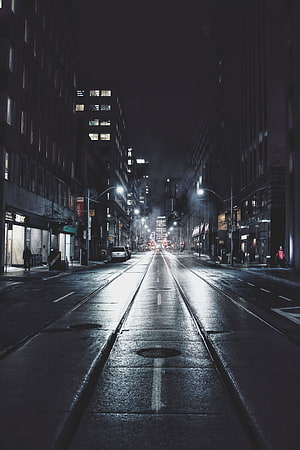 Moody Night Street in Toronto with Wet Asphalt and Glowing Streetlights HD phone wallpaper