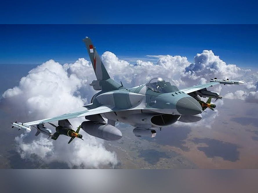 TNI AU Fighter Jet in Flight with Air-to-Air Missiles and Fuel Tanks HD wallpaper