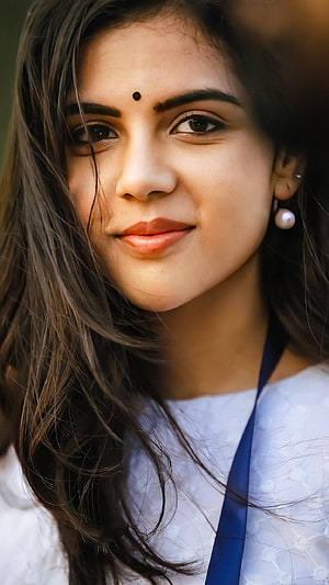 Kalyani Priyadarshini Portrait with Traditional Bind and Pearl Earrings HD phone wallpaper