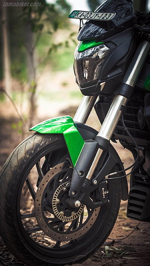 Bajaj Dominar 400 Front Wheel and Headlight Detail in Green and Black HD phone wallpaper