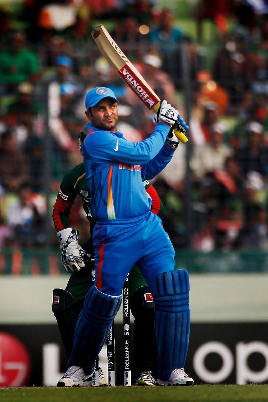 Virender Sehwag in Blue India Cricket Kit Raising Bat During International Match HD phone wallpaper