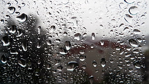 Macro Photography of Raindrops Beading on a Glass Window Surface HD wallpaper