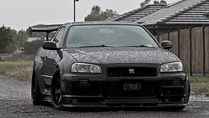Black Nissan Skyline GT-R R34 with Large Rear Wing in Rain HD wallpaper