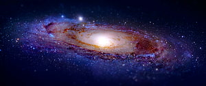 Spiral Galaxy with Bright Core and Dust Lanes in Deep Space HD wallpaper