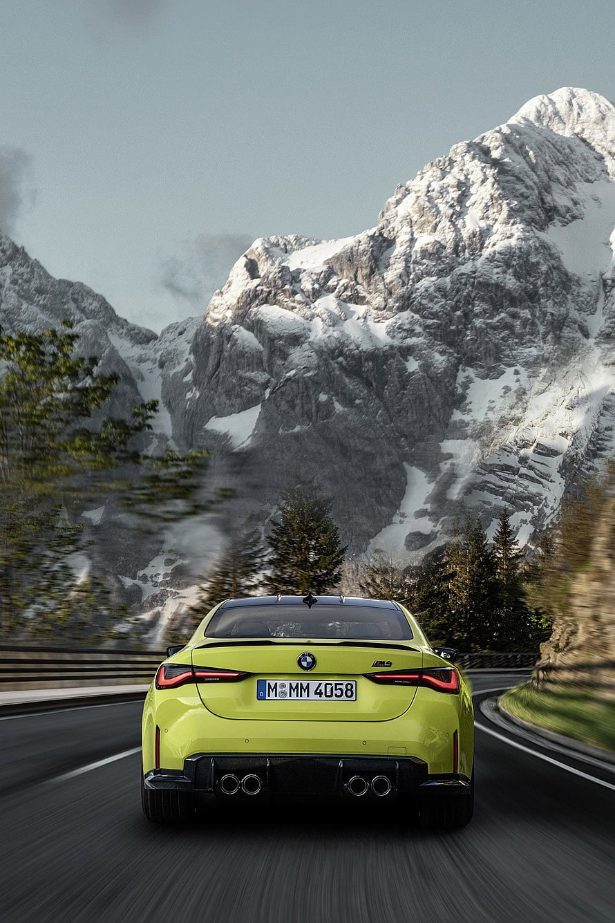 Rear View of a Lime Green BMW M4 Competition Driving on a Mountain Road HD phone wallpaper