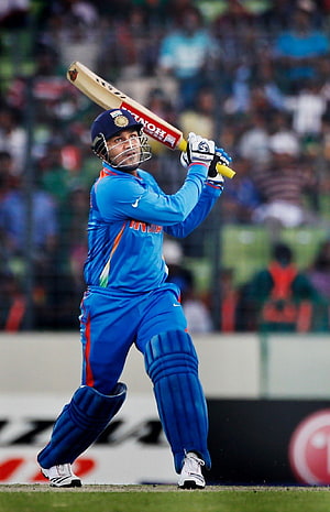 Virender Sehwag in Blue India Kit Playing a Powerful Cricket Shot at the 2011 ICC World Cup HD phone wallpaper
