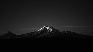 Monochrome Snow-Capped Mountain Peak in Dramatic Black and White Landscape HD wallpaper