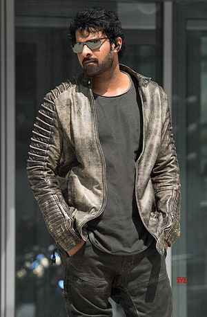 Prabhas in Saaho wearing a distressed leather jacket and sunglasses HD phone wallpaper
