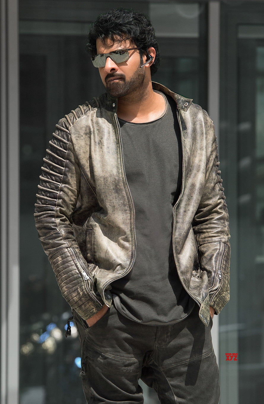 Prabhas in Saaho wearing a distressed leather jacket and sunglasses HD phone wallpaper
