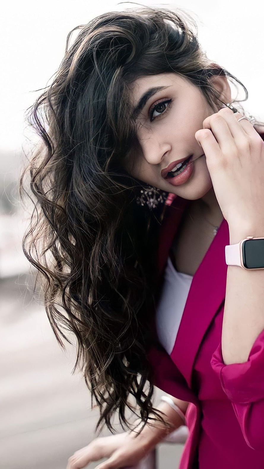 Sreeleela in a vibrant magenta blazer with wavy hair and a smartwatch HD phone wallpaper