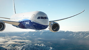 Boeing 787 Dreamliner Cruising Above Snow-Capped Mountain Ranges HD wallpaper