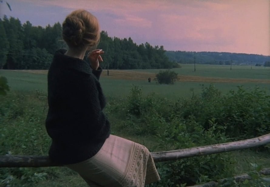 Woman in Black Sweater Gazing at Pastoral Landscape at Dusk in Tarkovsky's Mirror HD wallpaper