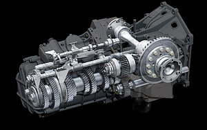 Cutaway view of a manual transmission assembly showing internal gears, shafts, and clutch mechanism HD wallpaper