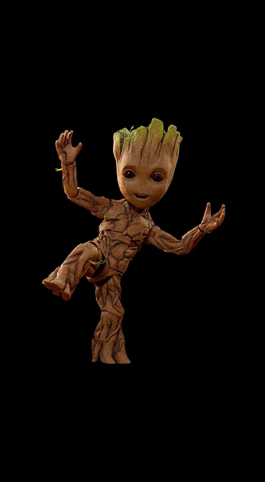 Baby Groot from Guardians of the Galaxy in a playful pose against a black background HD phone wallpaper