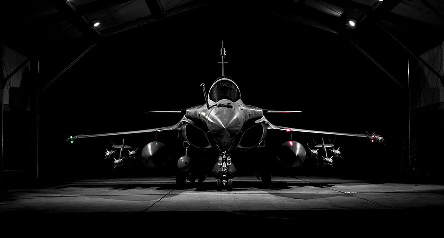Dassault Rafale Fighter Jet Front View in Hangar with Weapons and Fuel Tanks HD wallpaper