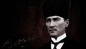 Mustafa Kemal Atatürk in Formal Attire with Signature on Dark Background HD wallpaper
