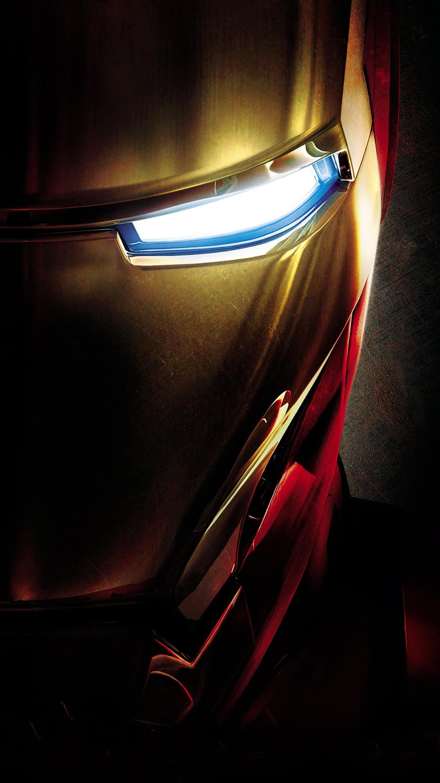 Iron Man Close-Up Portrait with Glowing Blue Eyes and Gold Armor in Dramatic Shadow HD phone wallpaper