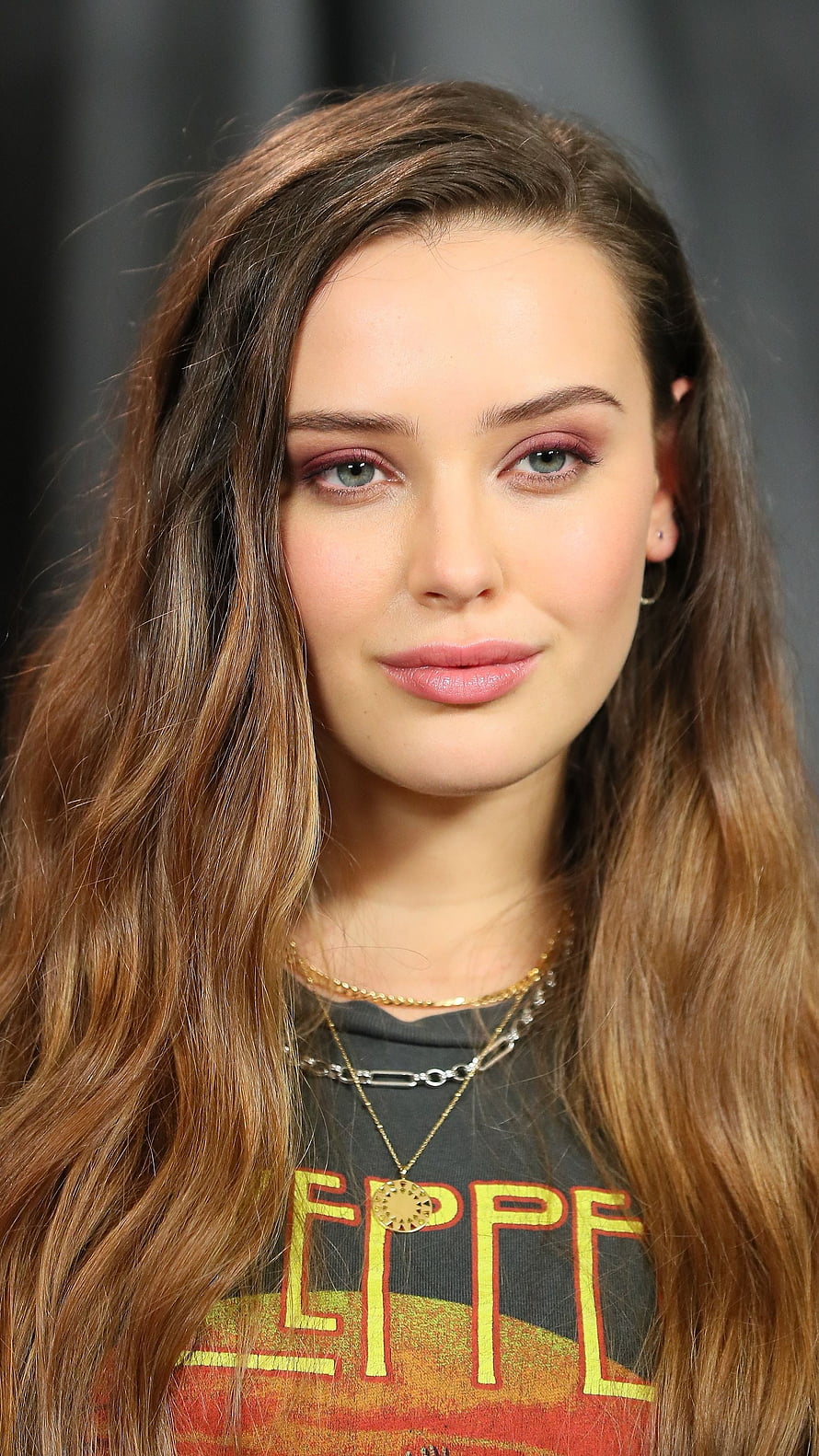 Katherine Langford Portrait With Long Wavy Hair And Layered Gold Necklaces HD phone wallpaper