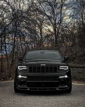 Black Jeep Grand Cherokee SRT Front View in Autumn Forest Setting HD phone wallpaper