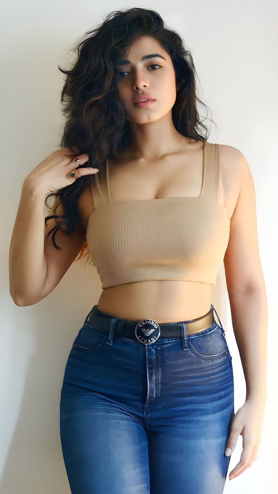 Kethika Sharma in a beige crop top and blue jeans with a black belt HD phone wallpaper