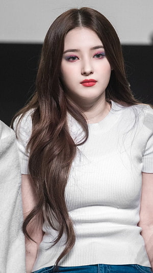 Nancy from Momoland in a white ribbed top with long wavy brown hair and bold pink eye makeup HD phone wallpaper