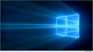 Windows 10 Blue Glowing Logo with Reflection on Dark Background HD wallpaper