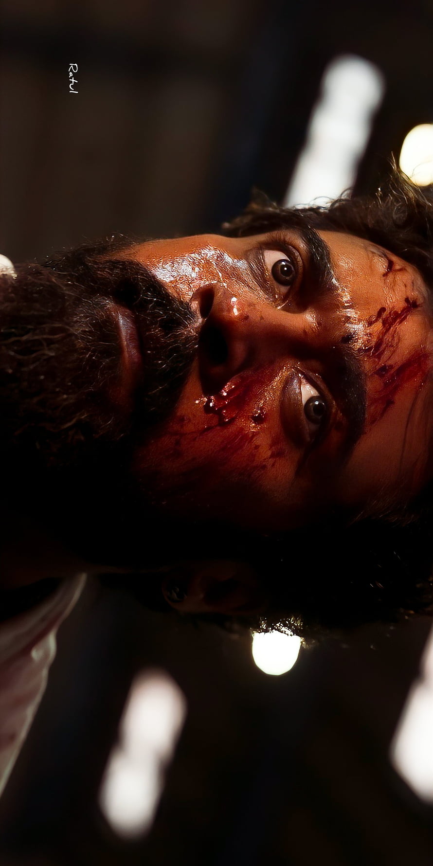 Suriya as Vikram in Intense Close-Up with Blood-Streaked Face and Dramatic Lighting HD phone wallpaper