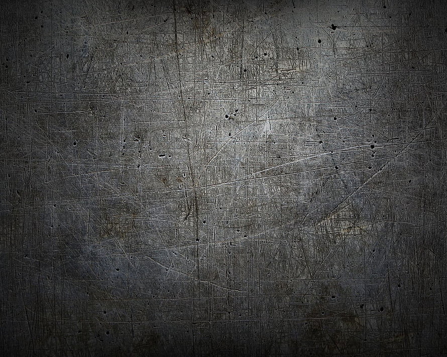 Dark scratched metal surface texture with industrial grunge and distressed finish HD wallpaper
