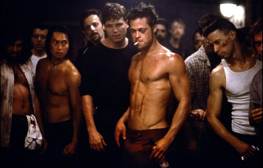 Brad Pitt shirtless in Fight Club with group of men in dimly lit room HD wallpaper