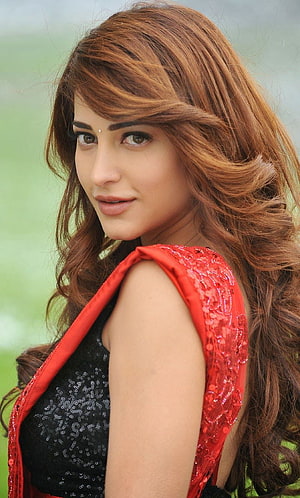 Shruthi Hassan Portrait in Red Sequined Outfit with Wavy Auburn Hair HD phone wallpaper