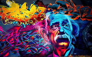 Vibrant Graffiti Portrait of Albert Einstein with Neon Street Art Lettering HD wallpaper