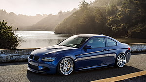 LeMans Blue BMW E92 M3 Coupe Parked on a Scenic Lakeside Road at Sunrise HD wallpaper
