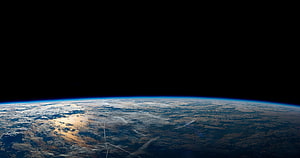 Planet Earth Curvature Viewed From Orbit With Atmospheric Glow Against Deep Space HD wallpaper