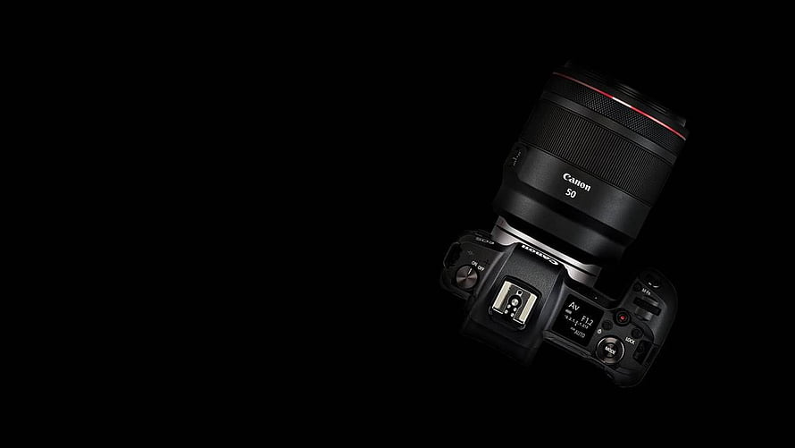 Canon EOS R Mirrorless Camera with 50mm Lens on Black Background HD wallpaper