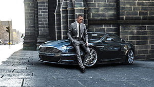 Daniel Craig as James Bond Leaning on Black Aston Martin DB10 in Edinburgh HD wallpaper