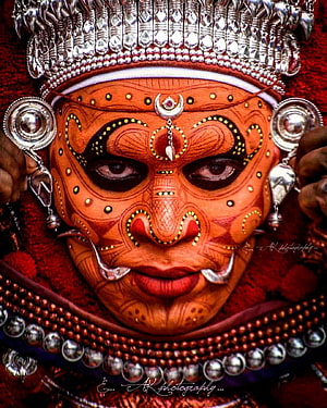 Traditional Theyyam Ritual Face Painting with Silver Headdress and Intricate Body Art HD phone wallpaper