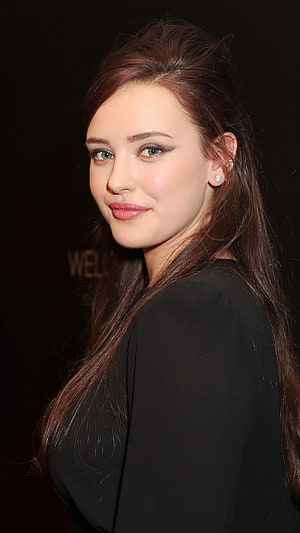 Katherine Langford in Black Attire with Long Brown Hair and Diamond Earrings HD phone wallpaper