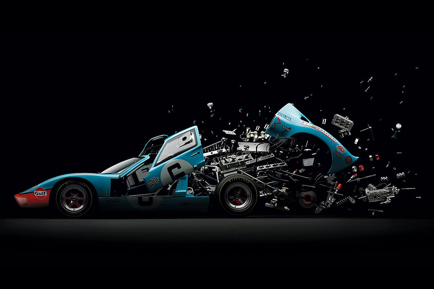Ford GT40 Exploded View: Disintegrating Race Car with Scattering Components on Black Background HD wallpaper