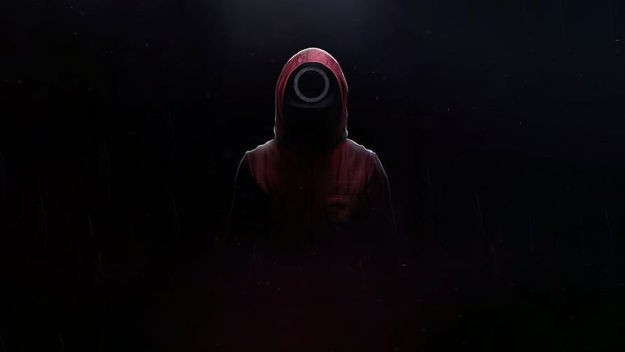 Squid Game Front Man Character in Red Hood and Mask Against Dark Background HD wallpaper