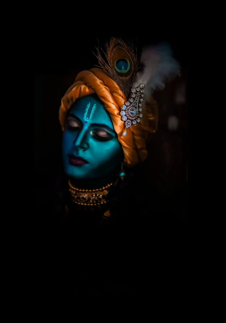 Krishna Portrait with Turquoise Skin, Peacock Feather Headdress, and Ornate Jewelry in Dramatic Low-Key Lighting HD phone wallpaper