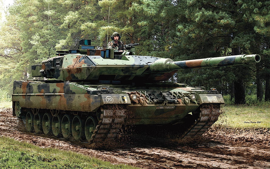 Leopard 2A5 Main Battle Tank Maneuvering Through Muddy Terrain in Forest HD wallpaper