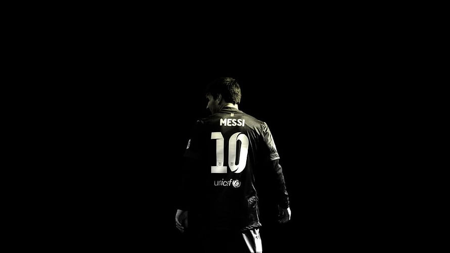 Lionel Messi in Barcelona Kit Walking Away in Dramatic Black and White Lighting HD wallpaper
