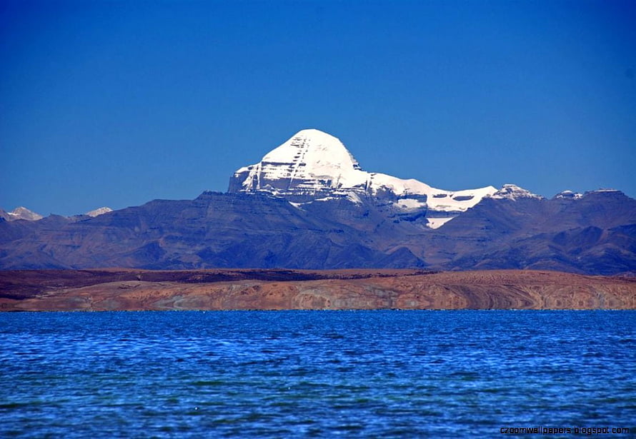 Mount Kailash Rising Above Mansarovar Lake in the Himalayas HD wallpaper