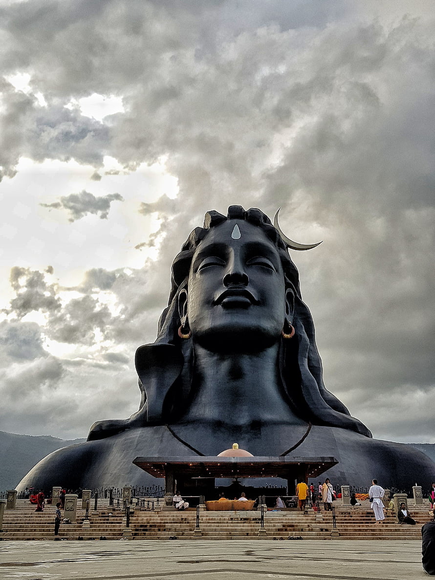 Adiyogi Statue at Isha Yoga Center Under Dramatic Cloudy Sky HD phone wallpaper