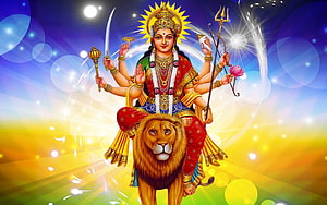 Maa Durga Riding Lion with Multiple Arms and Divine Weapons HD wallpaper