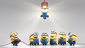 Minions in a Studio Light Setup with One Character Suspended Above a Group HD wallpaper